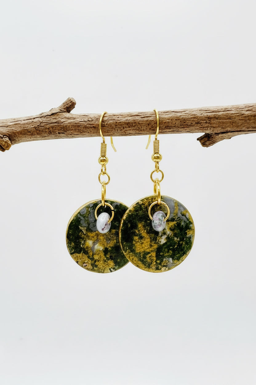 Handmade.  A pair of round dangle earrings with hand painted paper with textured green and gold circular faces. Backs are painted in a soft metallic gold tone.  Fronts are Sealed with an high gloss varnish. Gold hypoallergenic fishhook wires.