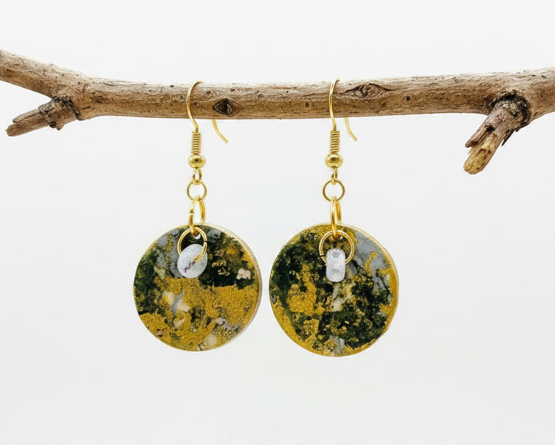 Handmade.  A pair of round dangle earrings with hand painted paper with textured green and gold circular faces. Backs are painted in a soft metallic gold tone.  Fronts are Sealed with an high gloss varnish. Gold hypoallergenic fishhook wires.