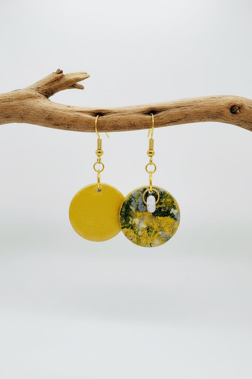 Handmade.  A pair of round dangle earrings with hand painted paper with textured green and gold circular faces. Backs are painted in a soft metallic gold tone.  Fronts are Sealed with an high gloss varnish. Gold hypoallergenic fishhook wires.