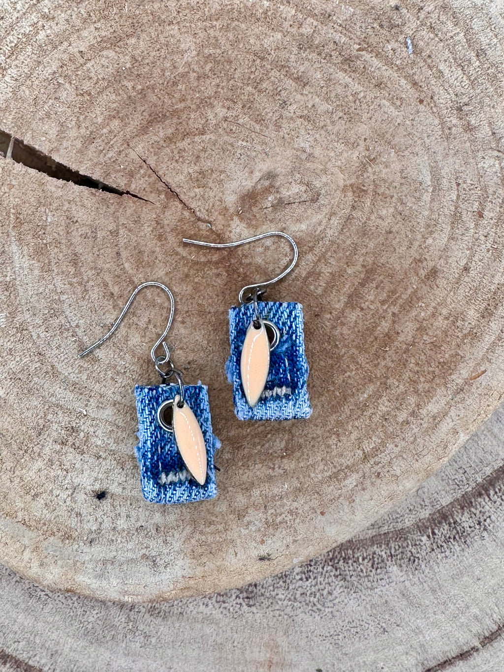 Handmade square denim earrings with silver fishhook wires and blush tone teardrop charm. Size without fishhook wires .75” Hypoallergenic, lightweight and fun to wear!