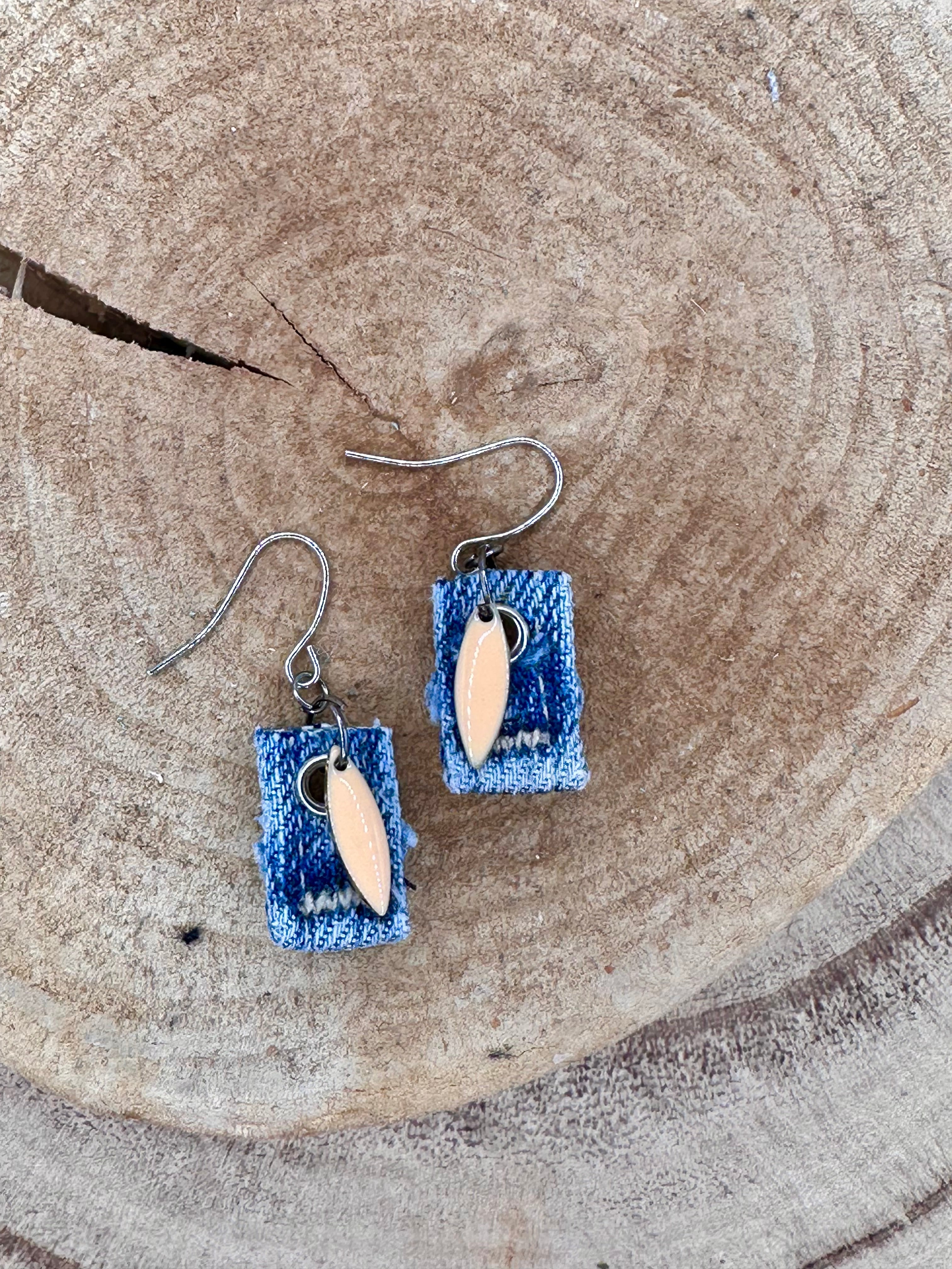 Handmade square denim earrings with silver fishhook wires and blush tone teardrop charm. Size without fishhook wires .75” Hypoallergenic, lightweight and fun to wear!