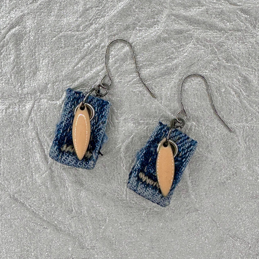 Handmade square denim earrings with silver fishhook wires and blush tone teardrop charm. Size without fishhook wires .75” Hypoallergenic, lightweight and fun to wear!