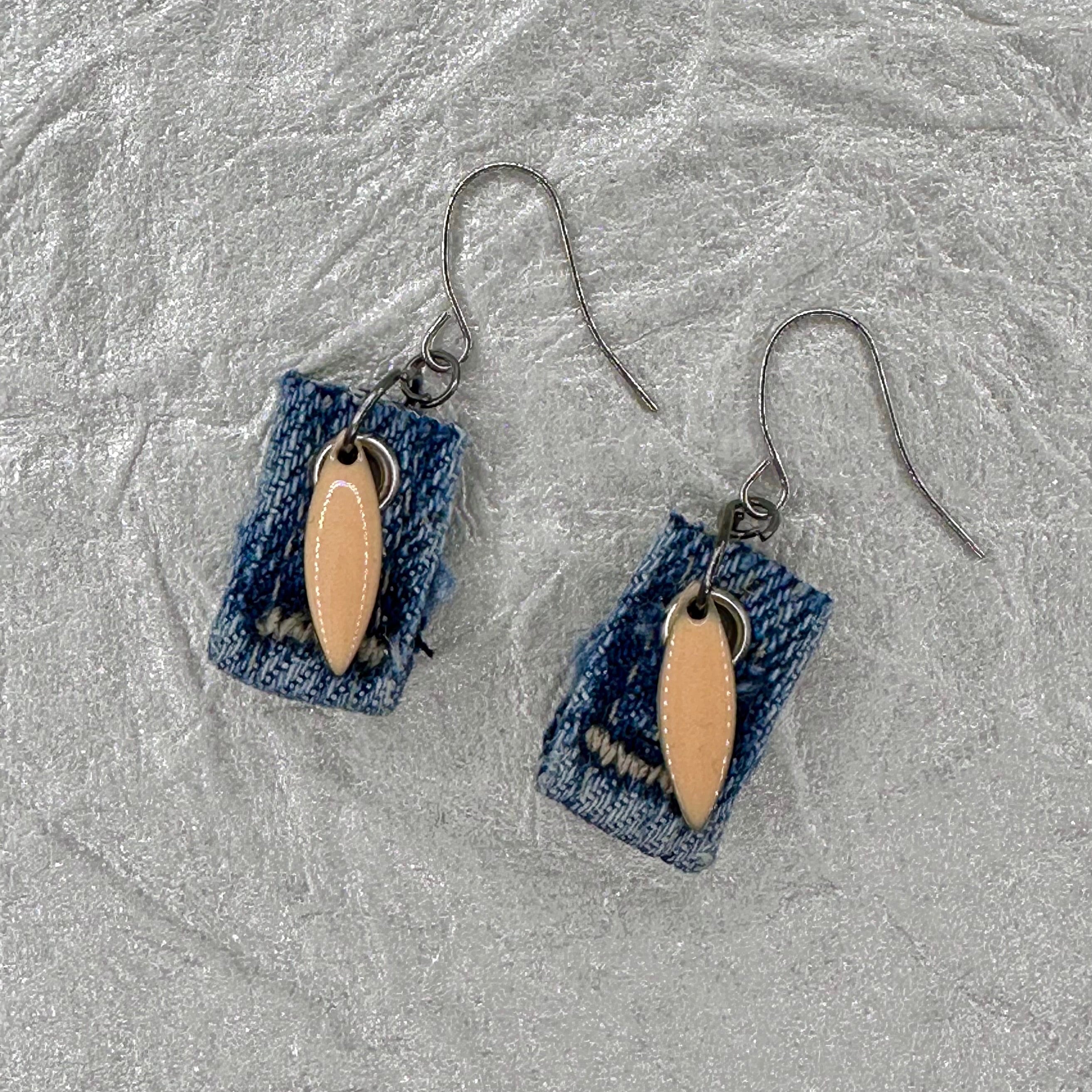 Handmade square denim earrings with silver fishhook wires and blush tone teardrop charm. Size without fishhook wires .75” Hypoallergenic, lightweight and fun to wear!
