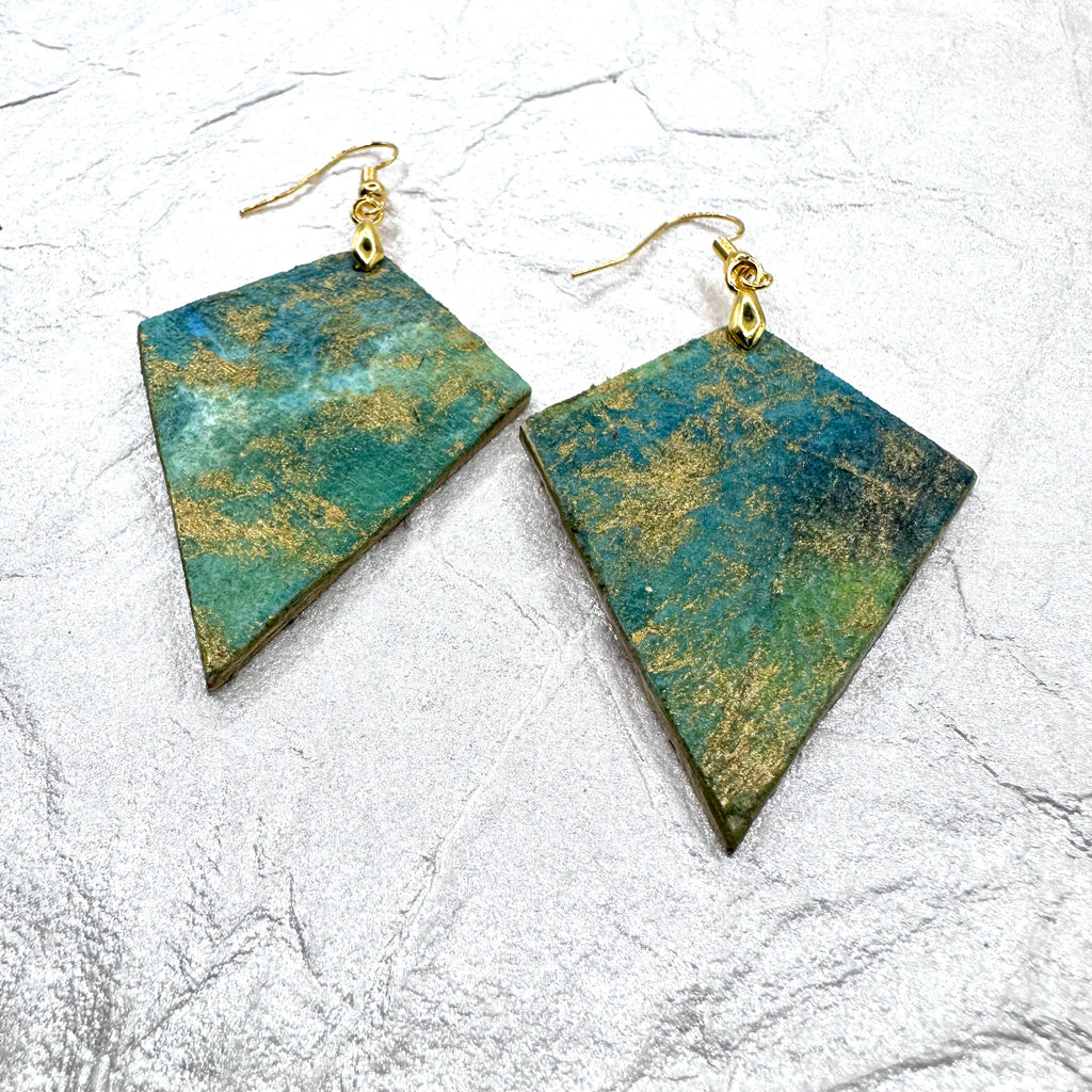 Hand painted earrings in marbled teal, green, and gold textured with gold-tone fishhook wires and diamond-shaped pendants. Hypoallergenic and light as a feather.  2" long without the earring wire.